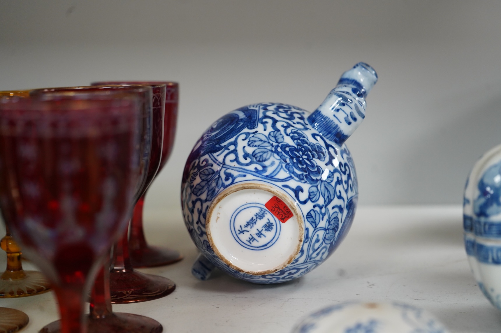 A group of Chinese blue and white comprising a dish and cover, two pillows, waterdropper and a teapot, largest 26cm wide